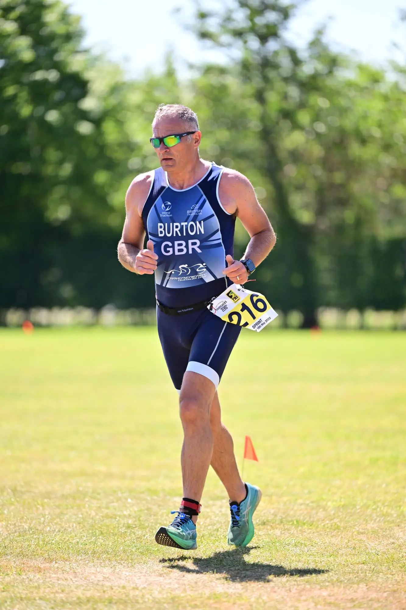 Sprint triathlete racing in Team GB kit through Cheddar Gorge