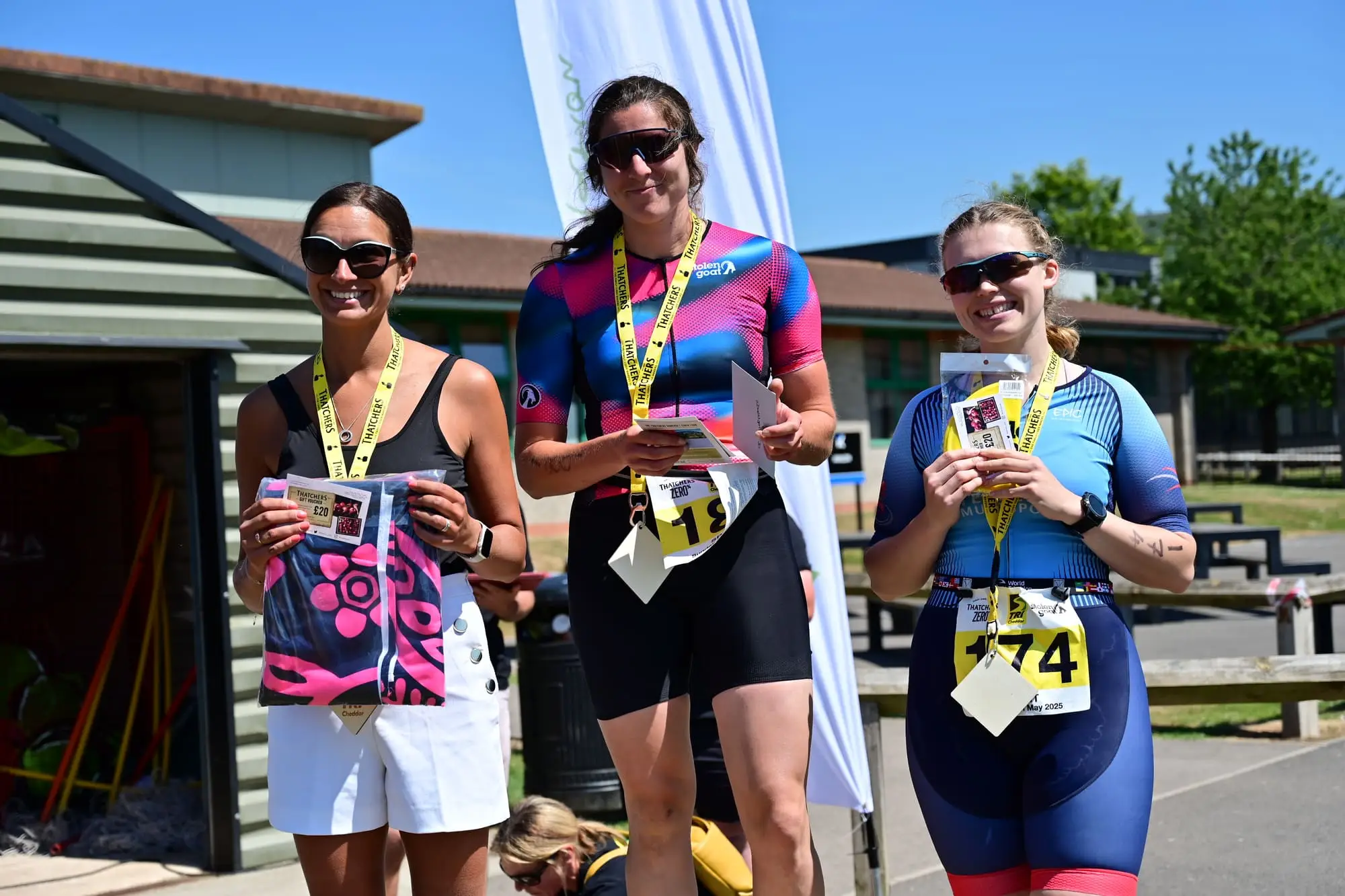 TriCheddar podium finishers holding their medals