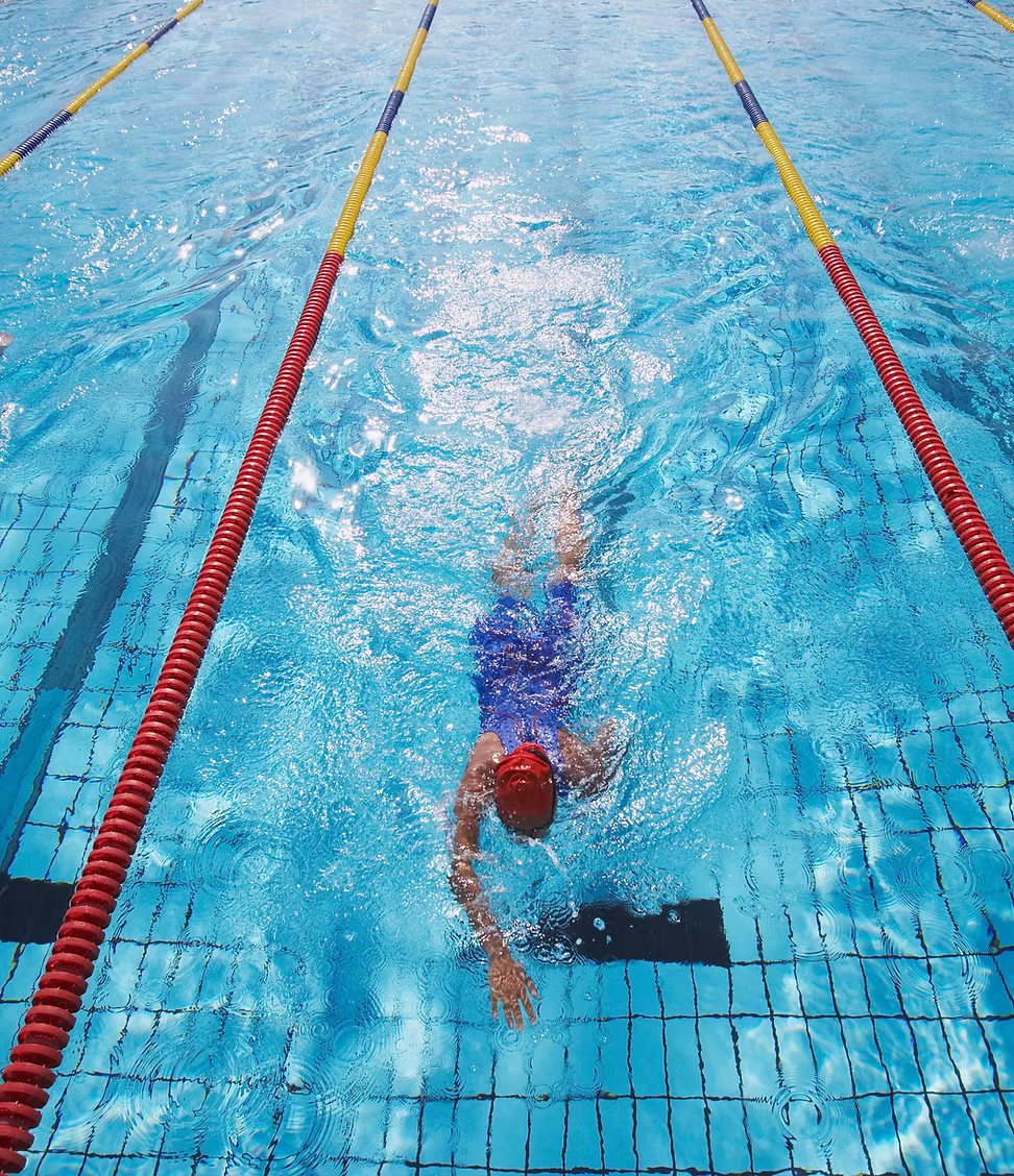 Swimmer racing in the pool at Kings of Cheddar